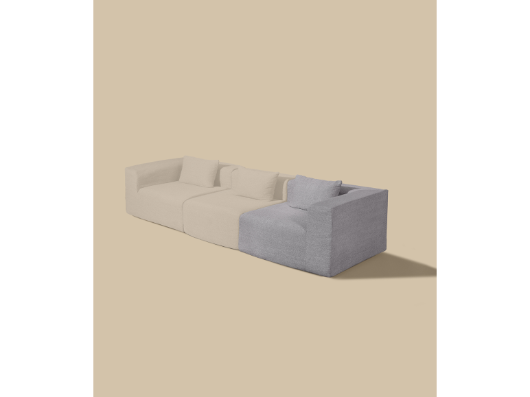 Modulaire bank met lichtbeige en grijze secties op een beige achtergrond.