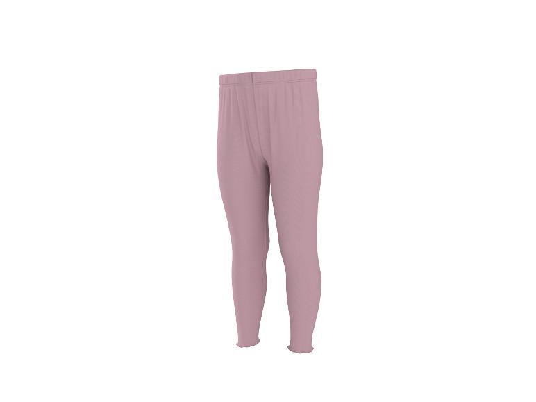 Lichtroze dameslegging met elastische tailleband en golvende zomen.