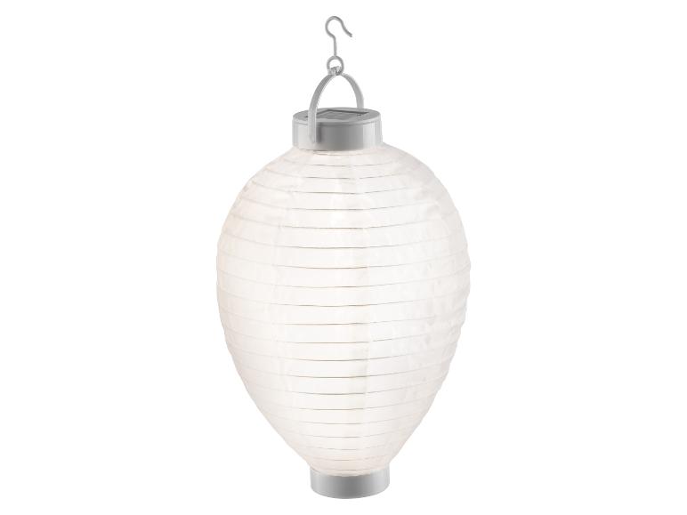 Witte op zonne-energie werkende papieren lantaarn met metalen haak.