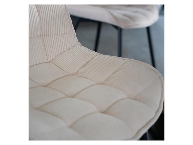 Detail van een beige corduroy gestoffeerde stoelzitting