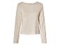 Beige trui met lange mouwen.
