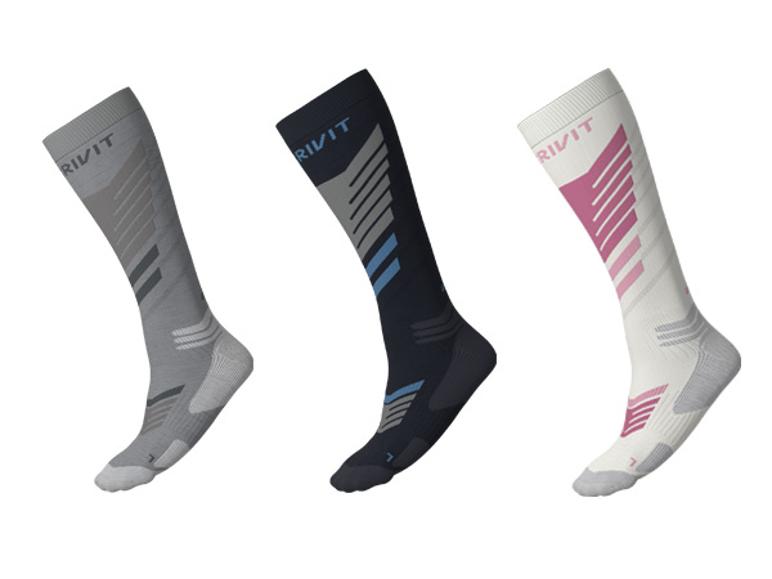 CRIVIT Unisex premium ski-functionele sokken in grijs, zwart en wit met kleuraccenten.