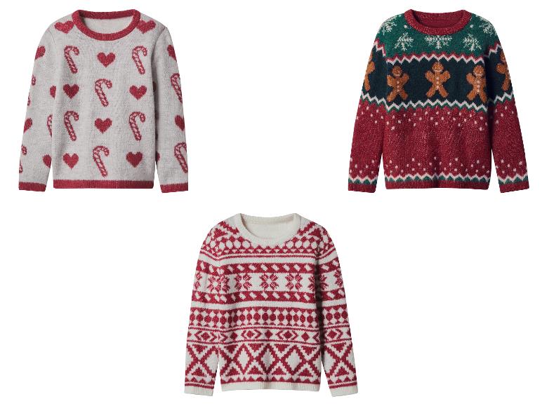 Drie feestelijke truien met vakantiepatronen, waaronder zuurstokken, harten, peperkoekmannetjes en sneeuwvlokken.