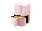 Een roze airfryer met frietjes erin.