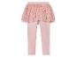 Roze leggings met een tule rokje met sterren en hartjes.