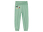 Groene joggingbroek met een vogel-print.