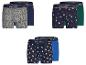 Drie tweepacks herenboxershorts met kerstthema-patronen.