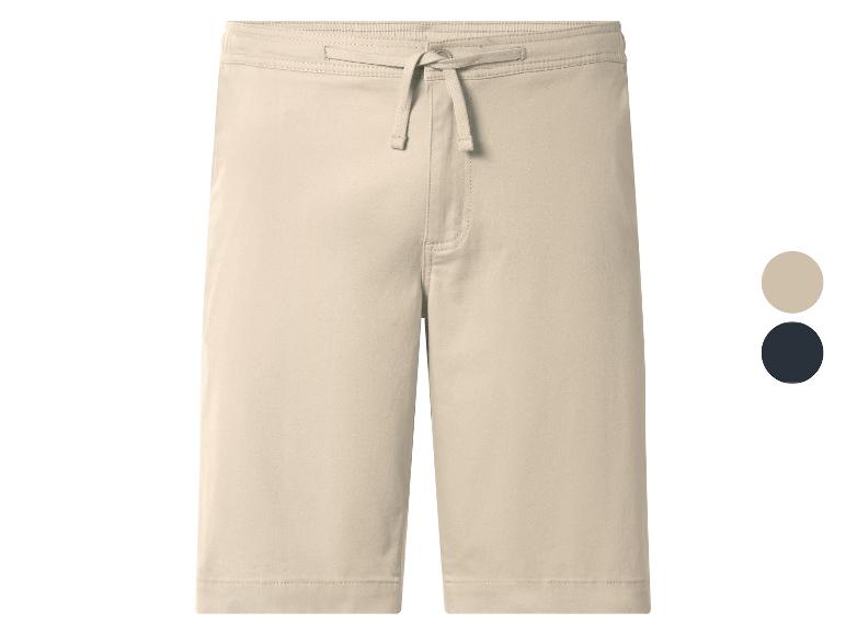 Beige short met trekkoord, getoond met kleurstalen in beige en marineblauw.