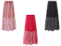 Drie gebreide rokken met mesh details: gestreept, rood en zwart.