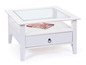 Witte salontafel met glazen blad en lade.
