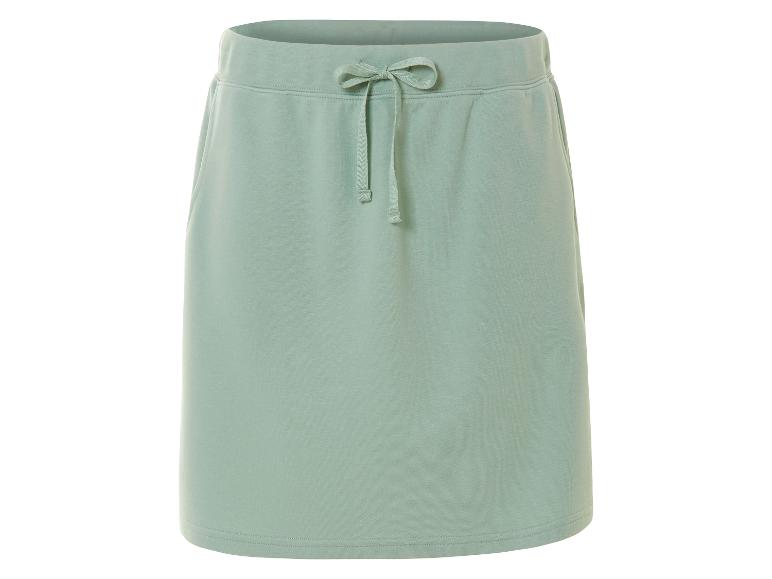 Kort, lichtgroen jersey rokje, casual stijl.