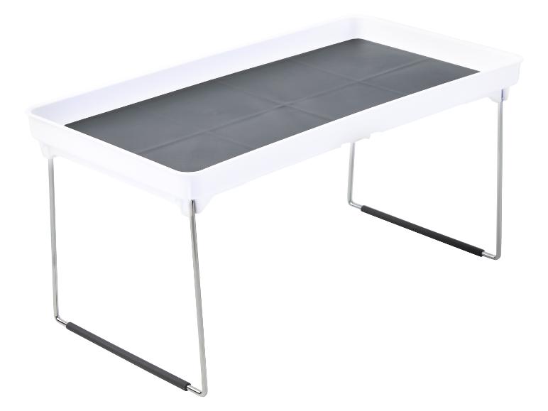 Opvouwbare witte dienblad met grijze inlay en metalen poten.