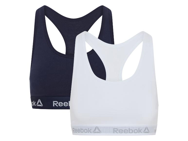 Twee Reebok sportbeha's, één donkerblauw en één wit
