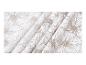 Witte stof met beige bloemenpatroon en plooien.