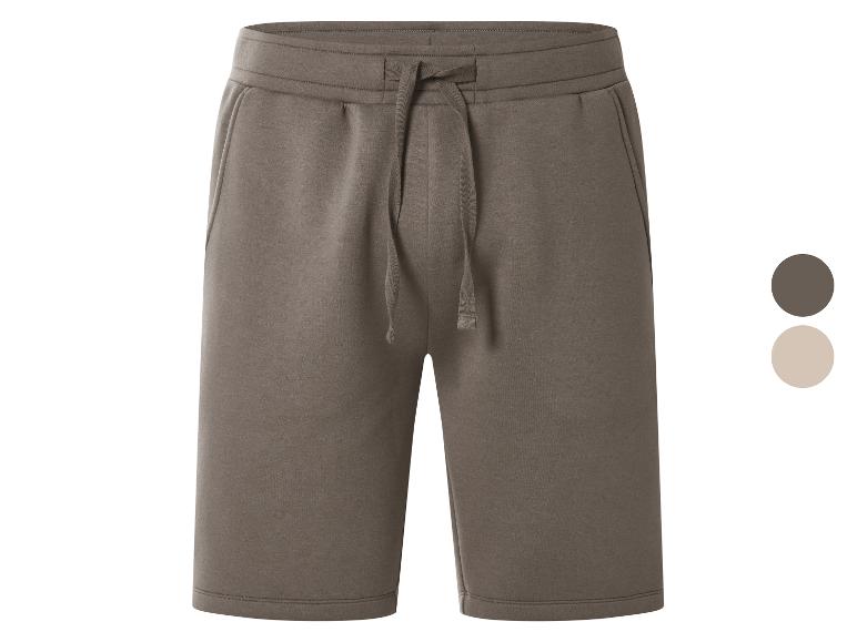Bruine sweatshorts met verstelbaar trekkoord, getoond met bruine en beige kleurstalen.