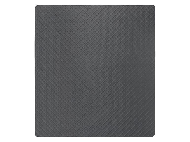 Donkergrijze, gewatteerde matras topper, ruitpatroon.