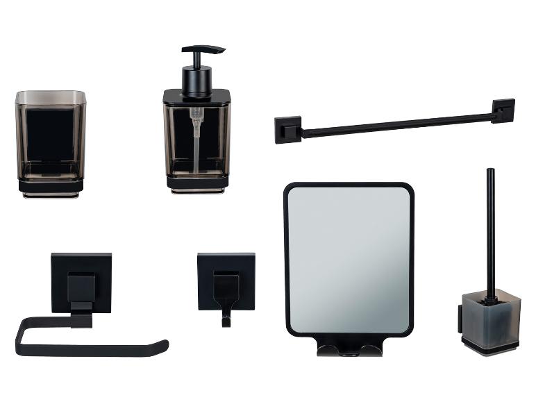 Moderne zwarte badkameraccessoiresset: zeepdispenser, tandenborstelhouder, spiegel, toiletrolhouder en toiletborstelhouder.